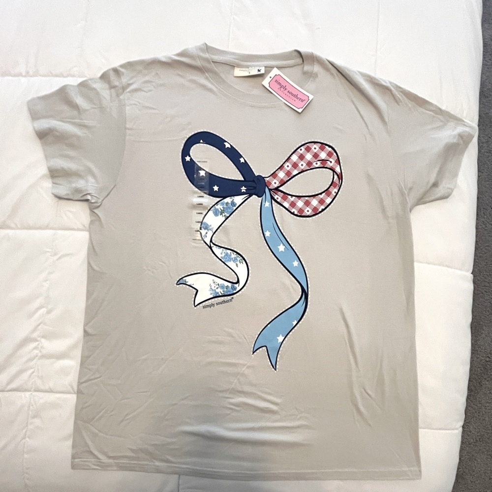 Simply Southern Festive Bow T-Shirt - Beige with Blue and Red Accents.Size Large